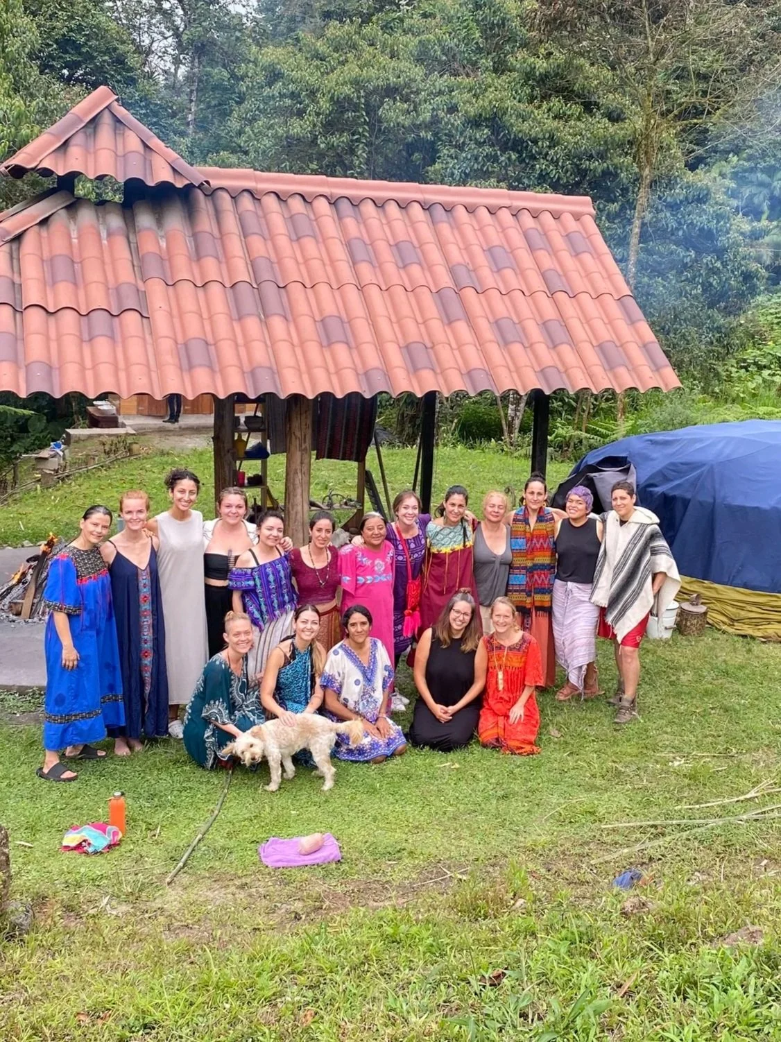 “Diverse women entering a community ceremony focused on connection, transformation, and ancestral-inspired ritual.”