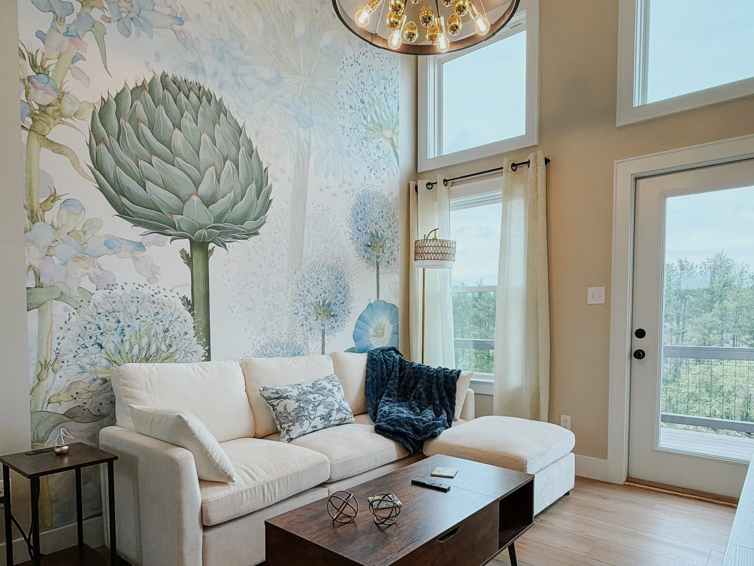 Modern living area with statement floral mural.
