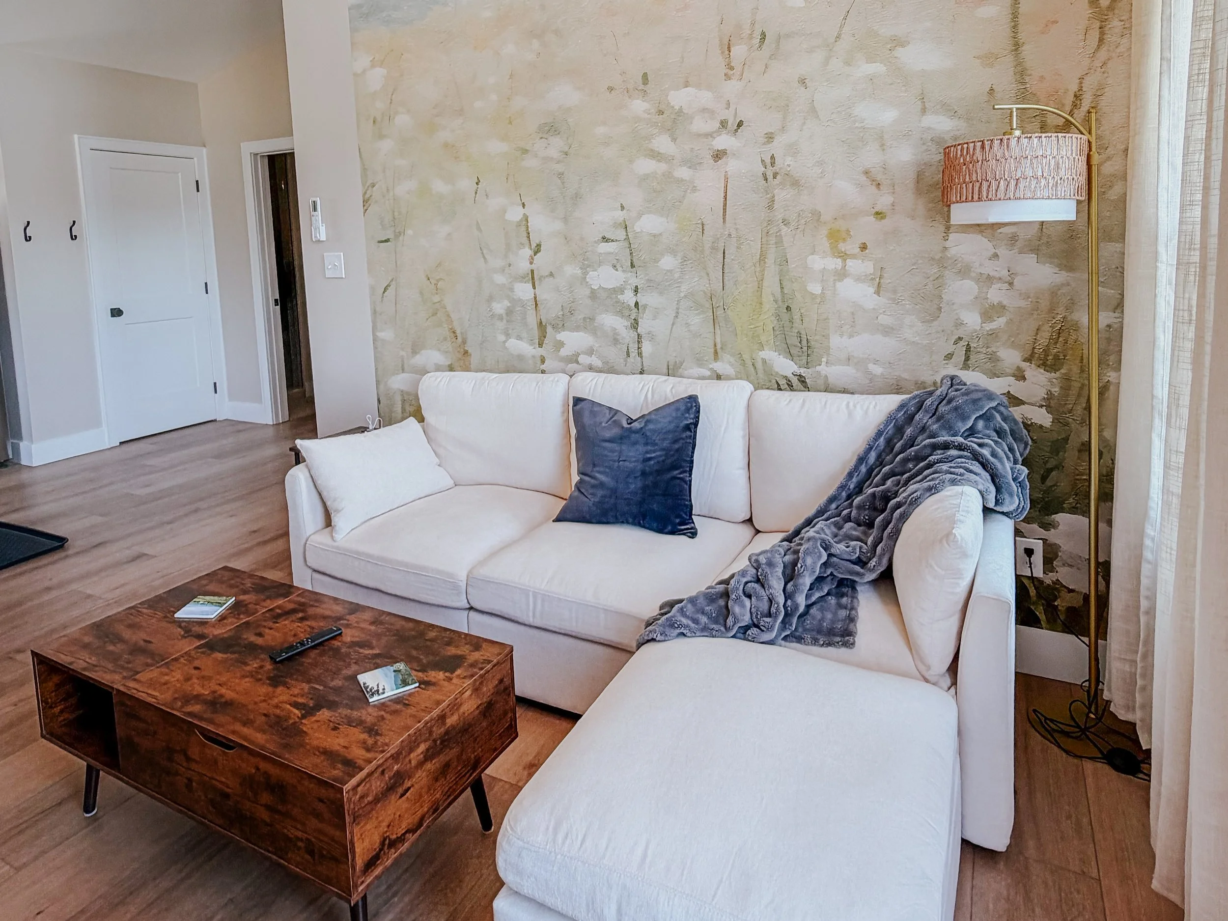 Luxury tiny house with soft wildflower mural.