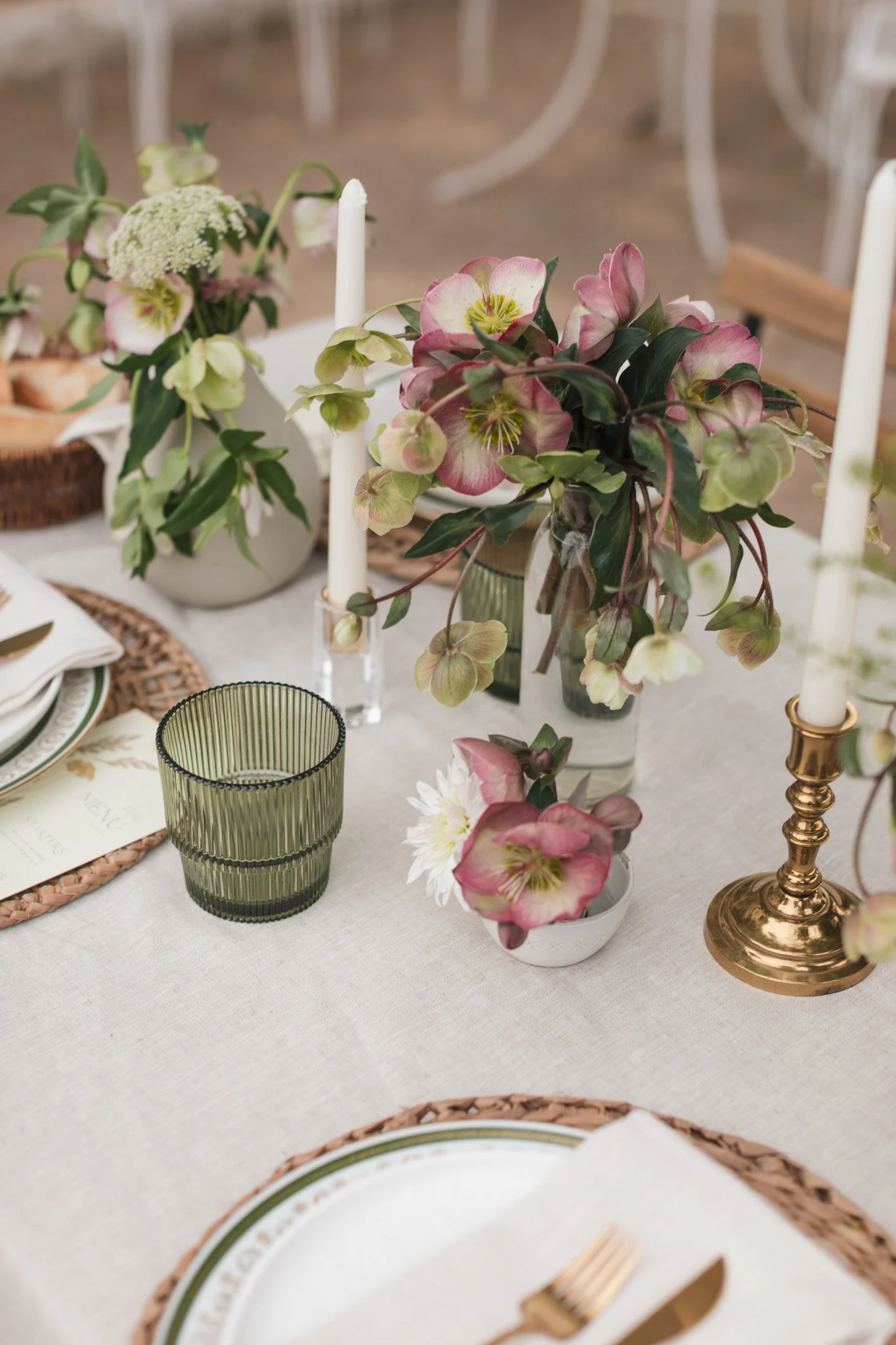 Intimate Central Coast elopement reception table with floral centerpieces, candles, and elegant place settings.