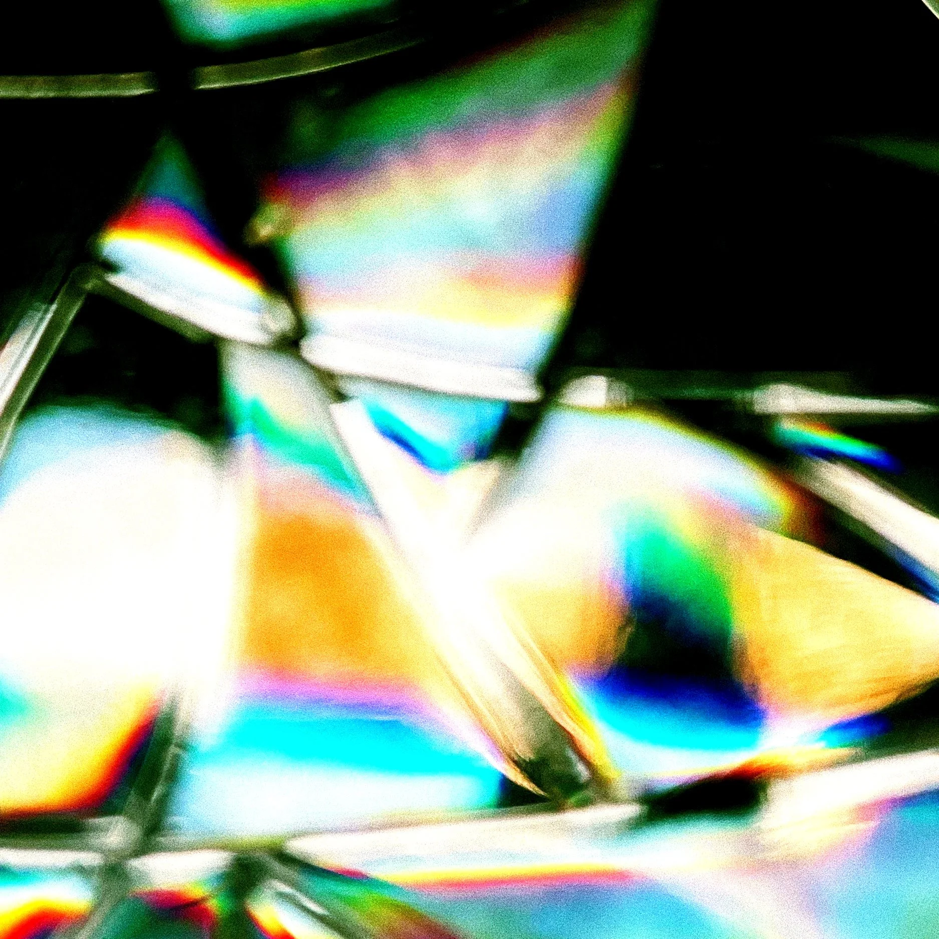 Close-up on celophane shards and their rainbowed diffraction of light