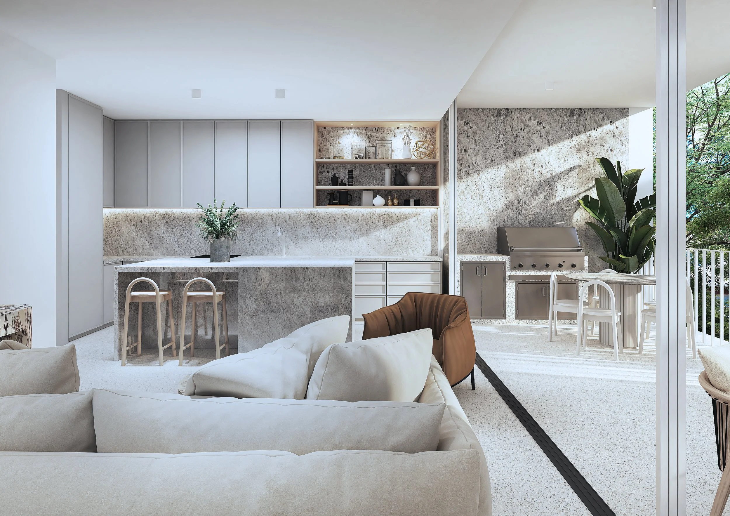 Modern open-concept living and kitchen area with neutral tones, minimal decor, a white couch, a kitchen island with bar stools, and outdoor view with trees.