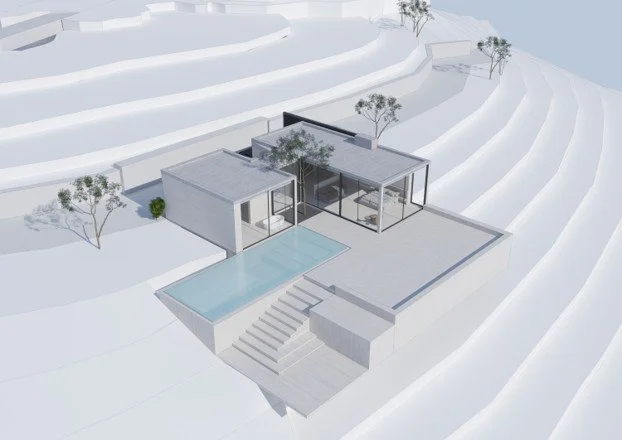 Modern white house with large glass windows, situated on a snow-covered hillside, featuring a swimming pool and surrounding trees.