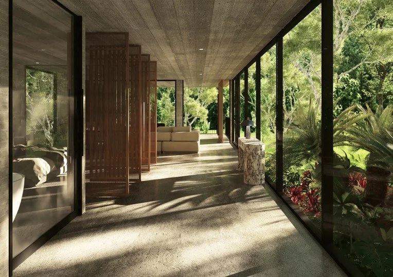 Interior of a modern house with large glass windows showing a lush green outdoor garden.