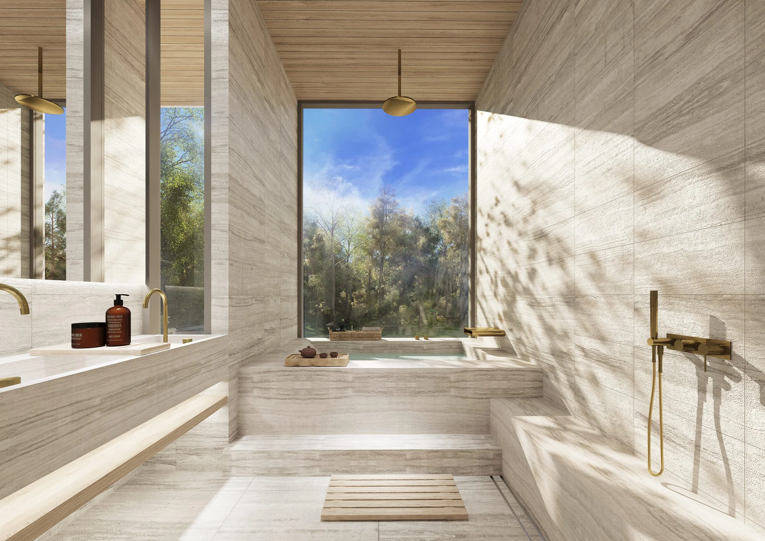 Modern bathroom with large windows, beige stone walls, wooden ceiling, and outdoor view of trees. Features a built-in bathtub, gold fixtures, and a shower area with a gold handrail.