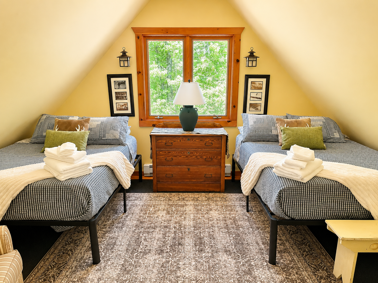 Loft bedroom at Five Star Lodge featuring two full-size beds, warm Adirondack décor, and comfortable accommodations for families and groups near Gore Mountain in North Creek, NY.