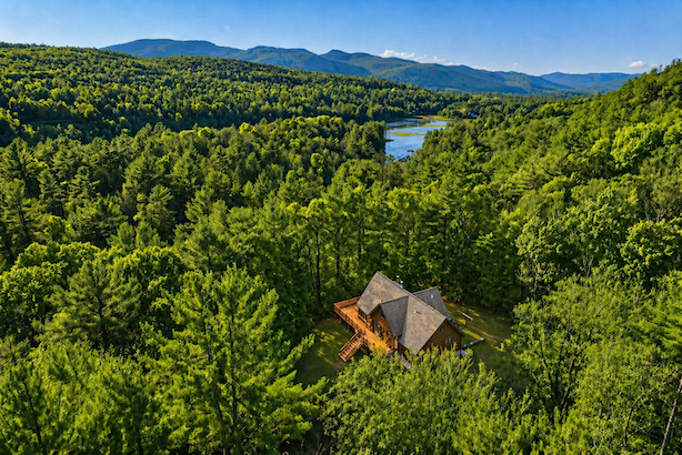 An aerial view of 5 Star Lodge with the Adirondack Mountains in the background