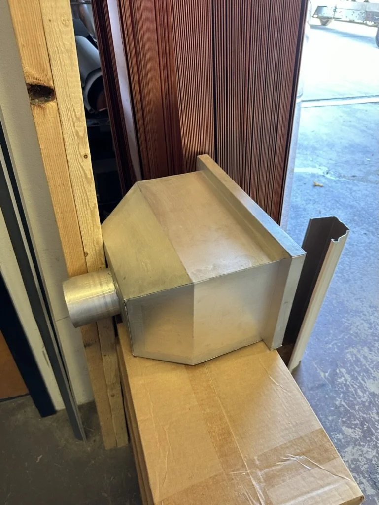 A large freedom grey copper leader head / scupper box.