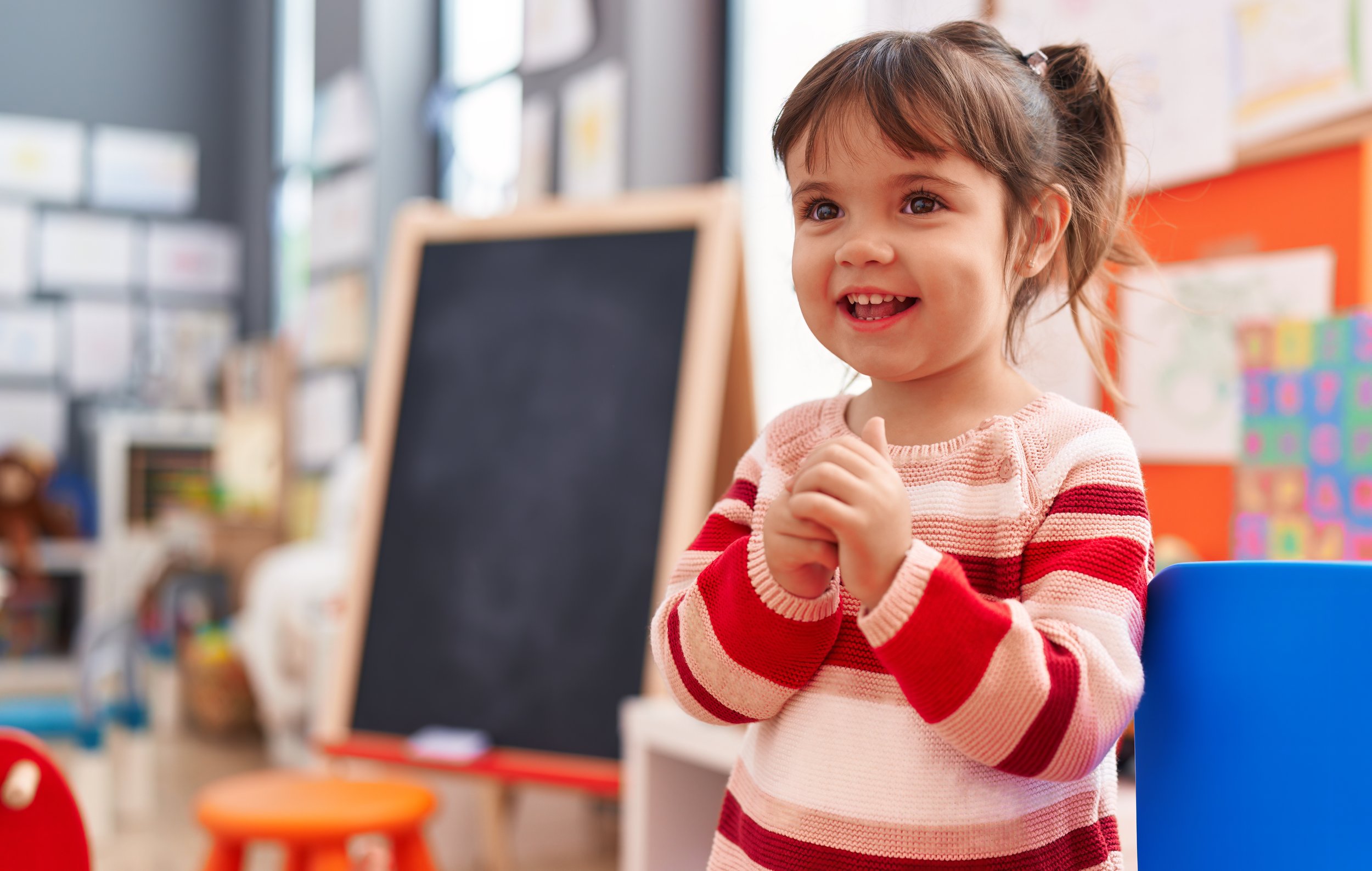 Preschool child praying in Christian daycare