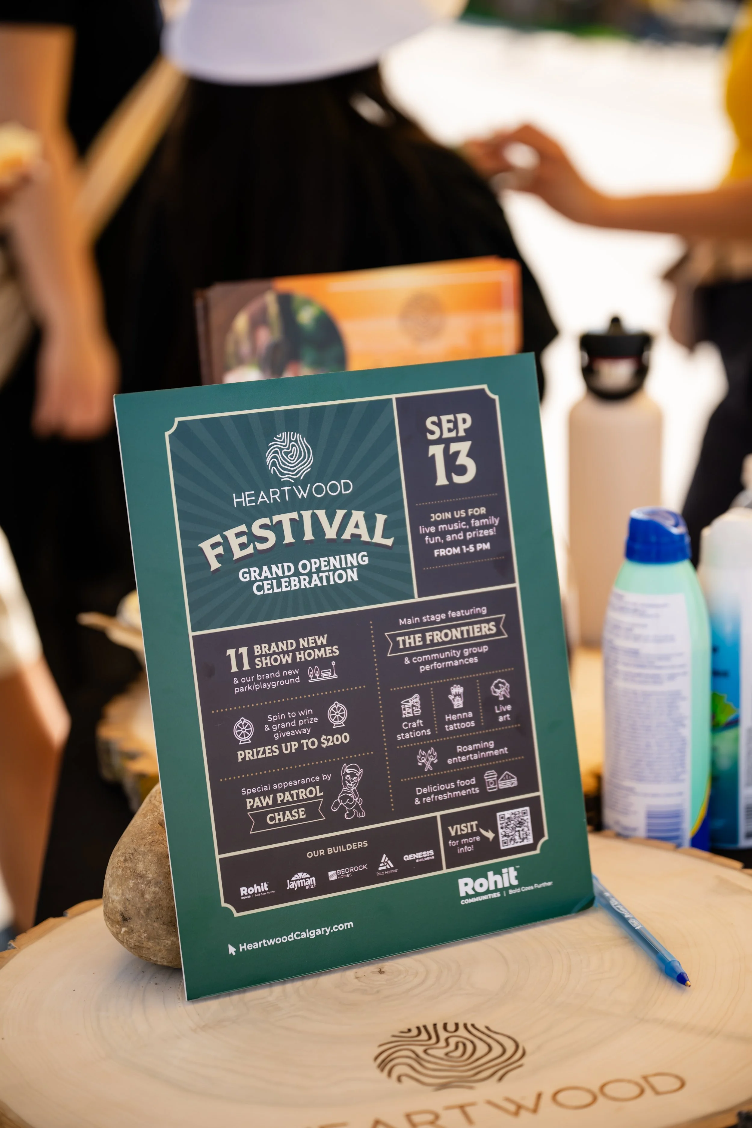 Event flyer for Heartwood Festival's grand opening celebration on September 13th, featuring live music, community performances, craft stations, and food.