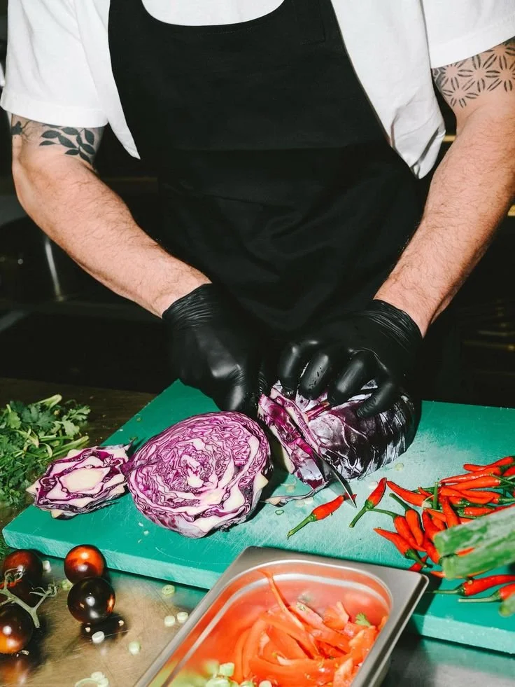 Chef chopping Vegetables on a green chopping board