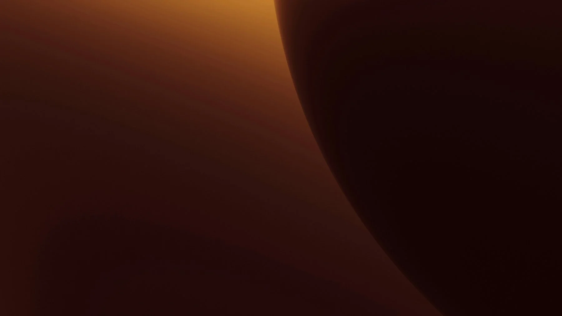A close-up of a dark, glossy, brown object with a smooth surface, possibly a piece of chocolate or a similar item.