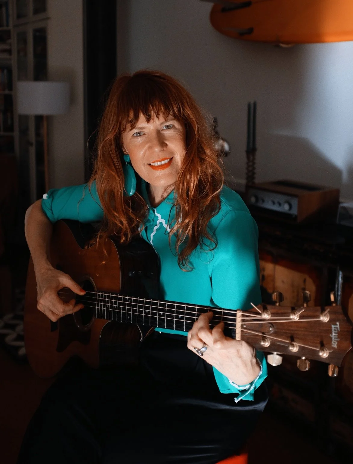 Melia with guitar face front.jpeg