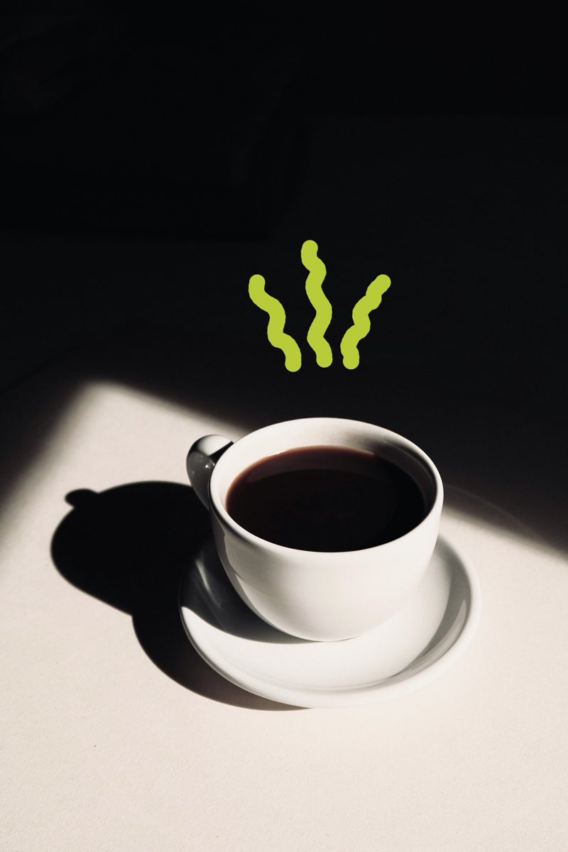 A white coffee cup filled with black coffee on a saucer, with steam drawn above it, on a white surface with dark shadows.