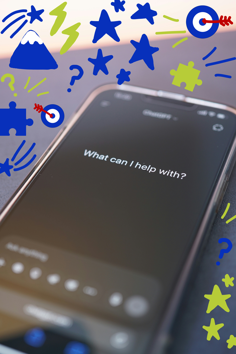 An iPhone with the screen displaying 'What can I help with?' and colorful illustrations of stars, a mountain, lightning bolts, puzzle pieces, and a target with an arrow.