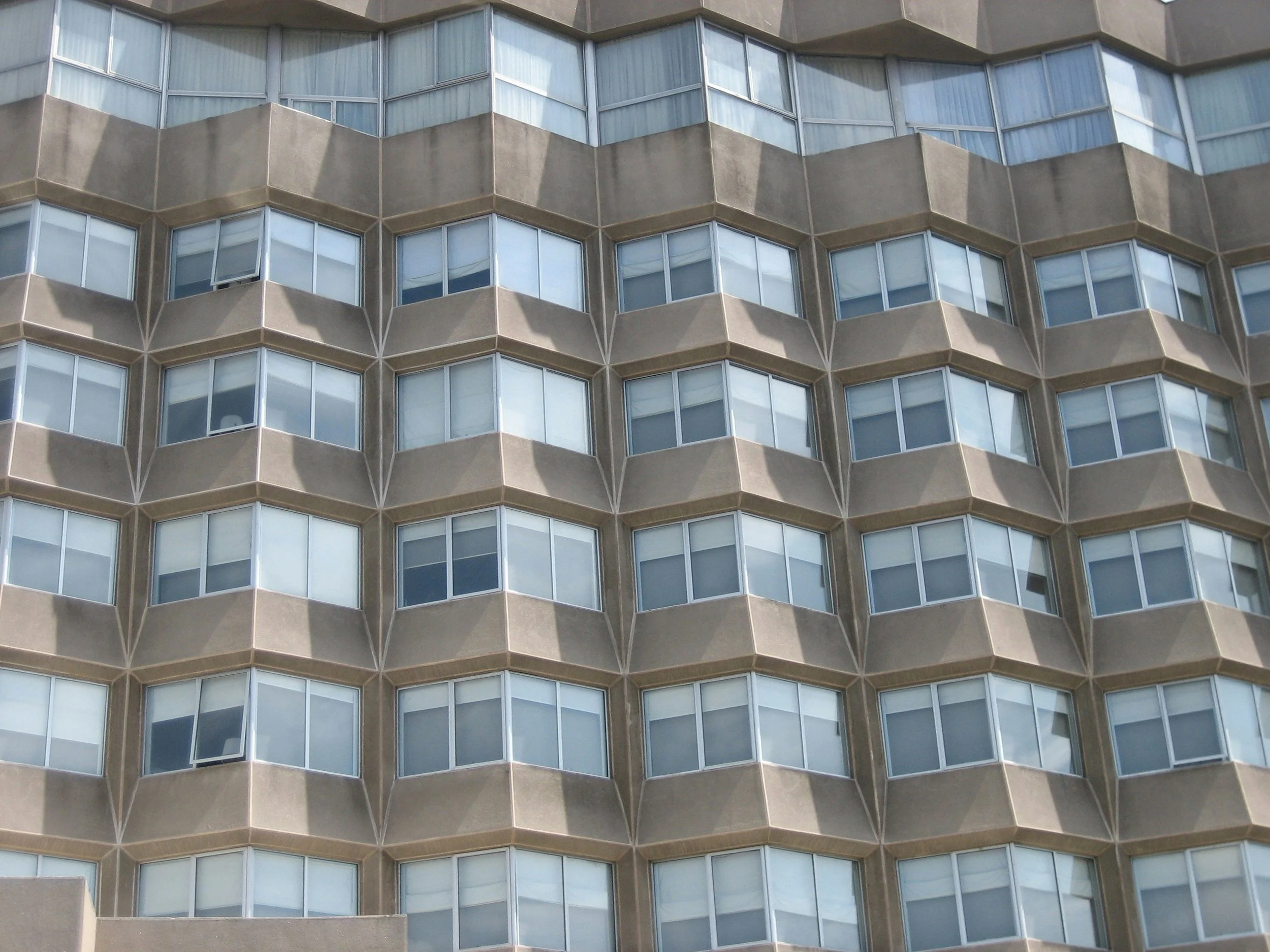 Brutalist building with lots of windows.