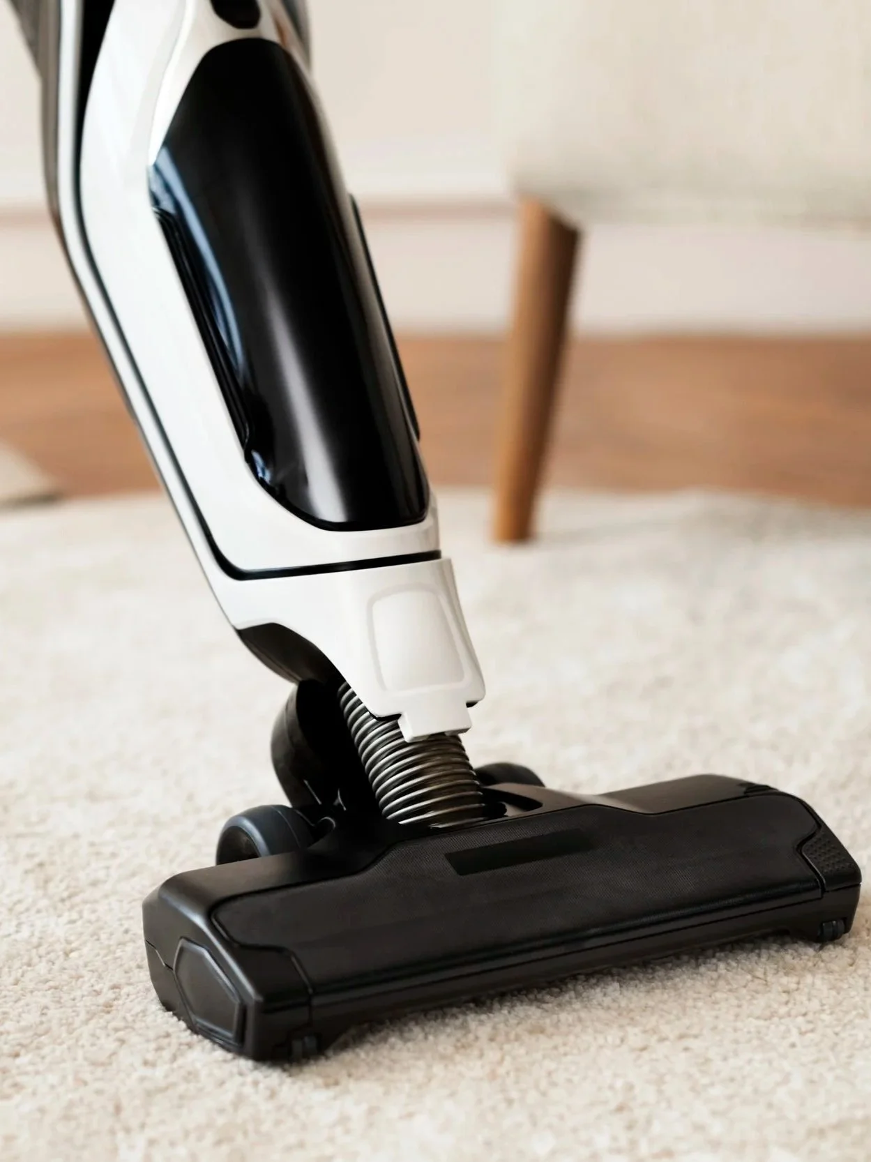 Vacuum cleaner on carpet, steam cleaning service.