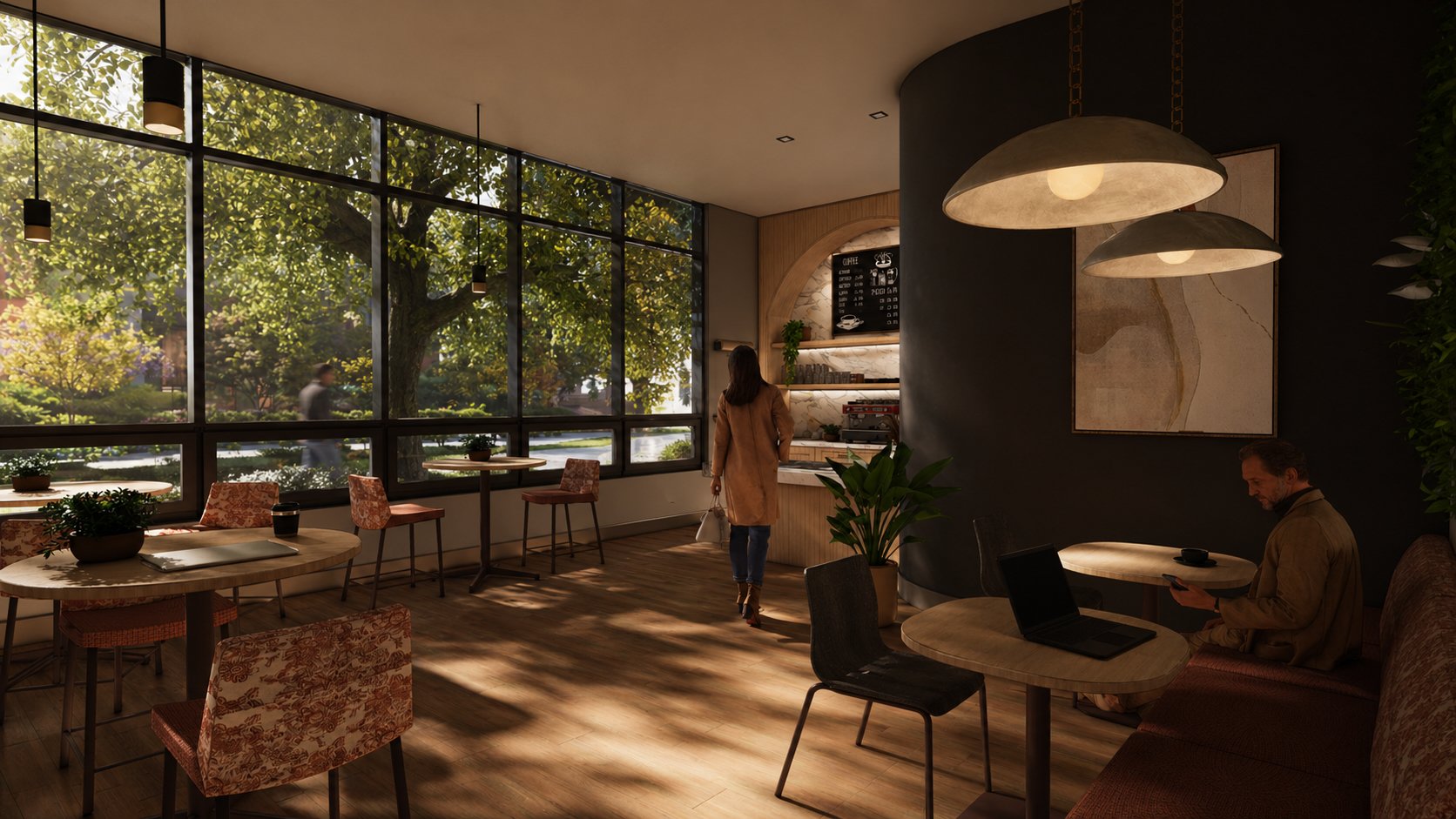 Café — A bright, approachable gathering space with accessible seating, durable finishes, natural light, and integrated greenery designed for casual dining and daily connection.