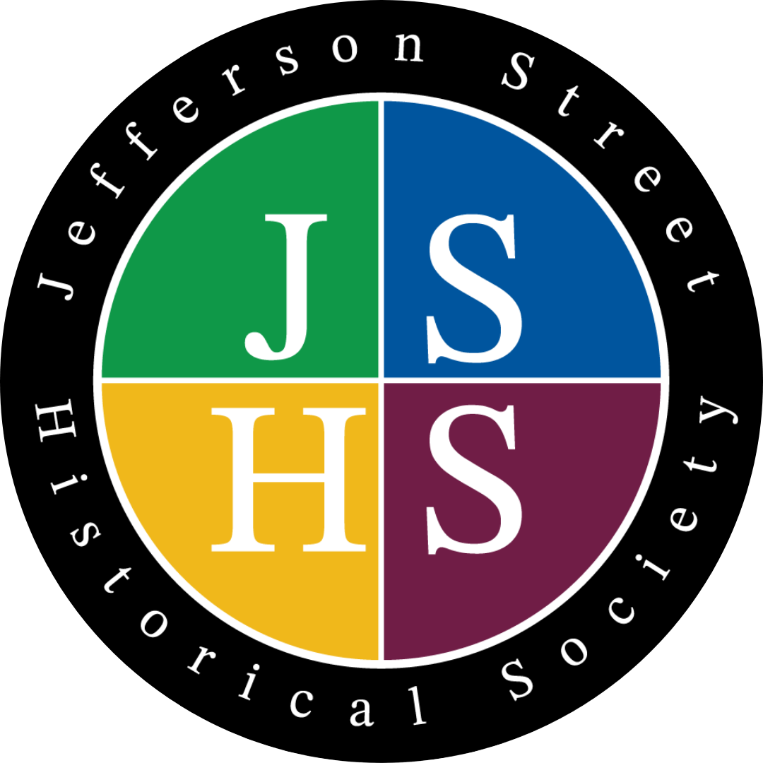 Logo for Jefferson Street Historical Society. A circular logo with four quadrants, each containing a letter: J, S, H, S. The quadrants are colored green, blue, yellow, and maroon respectively.