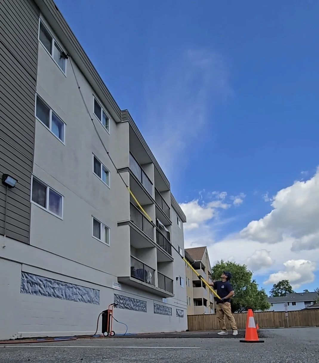 Low-rise strata townhome exterior window cleaning using a 40-foot water-fed pole system in the Ladner and Tsawwassen region.