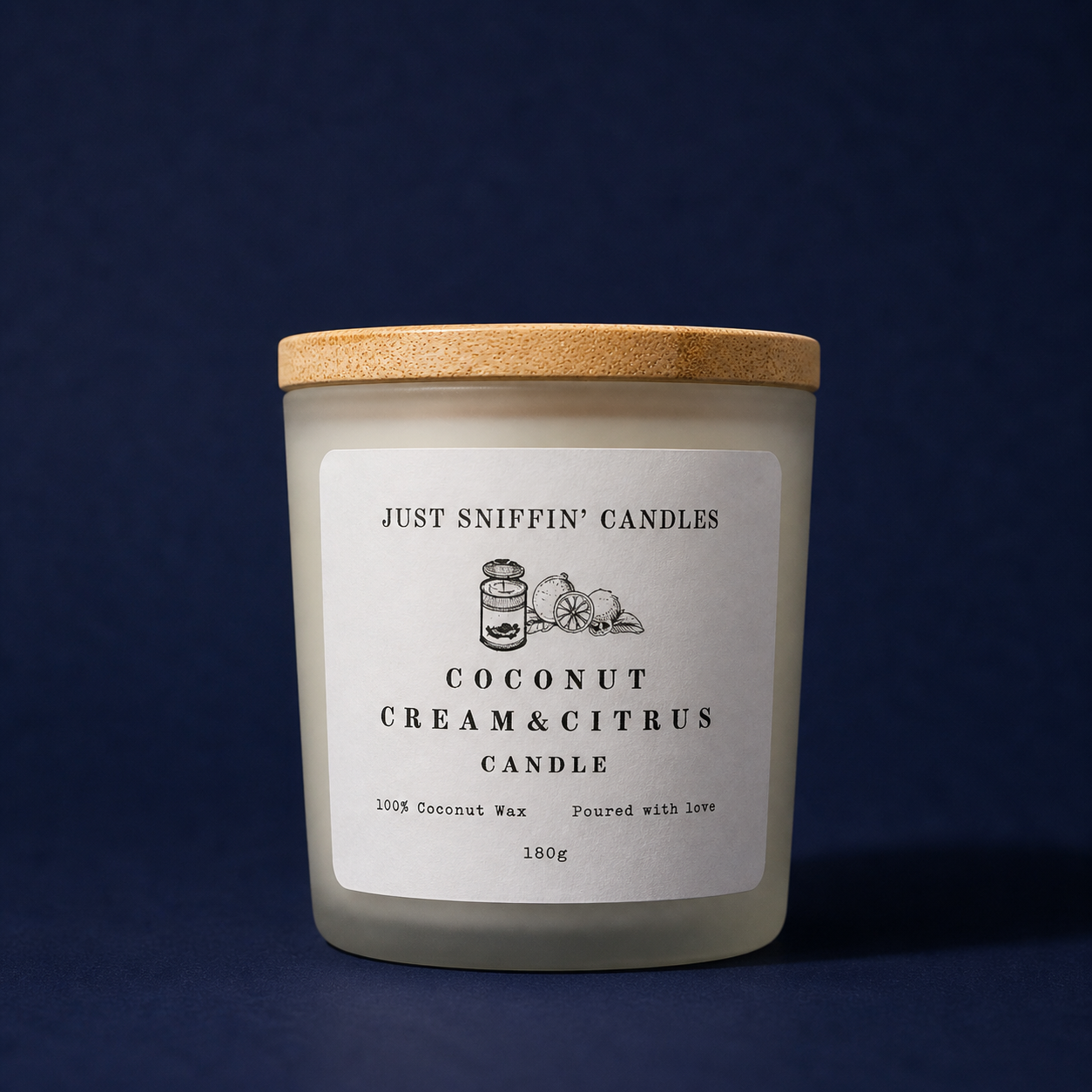 A candle jar labeled 'Just Sniffin' Candles' with a coconut, lemon, and citrus illustration, made of white wax with a wooden lid, set against a dark blue background.