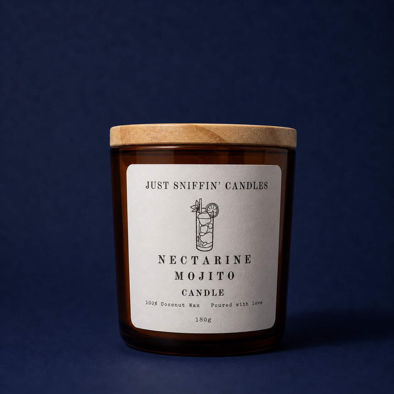A candle in a brown glass jar with a wooden lid, labeled 'Just Sniffin' Candles, Nectarine Mojito Candle, 100% Coconut Wax, Poured with Love, 180g', and a simple illustration of a cocktail drink on the label, set against a dark blue background.