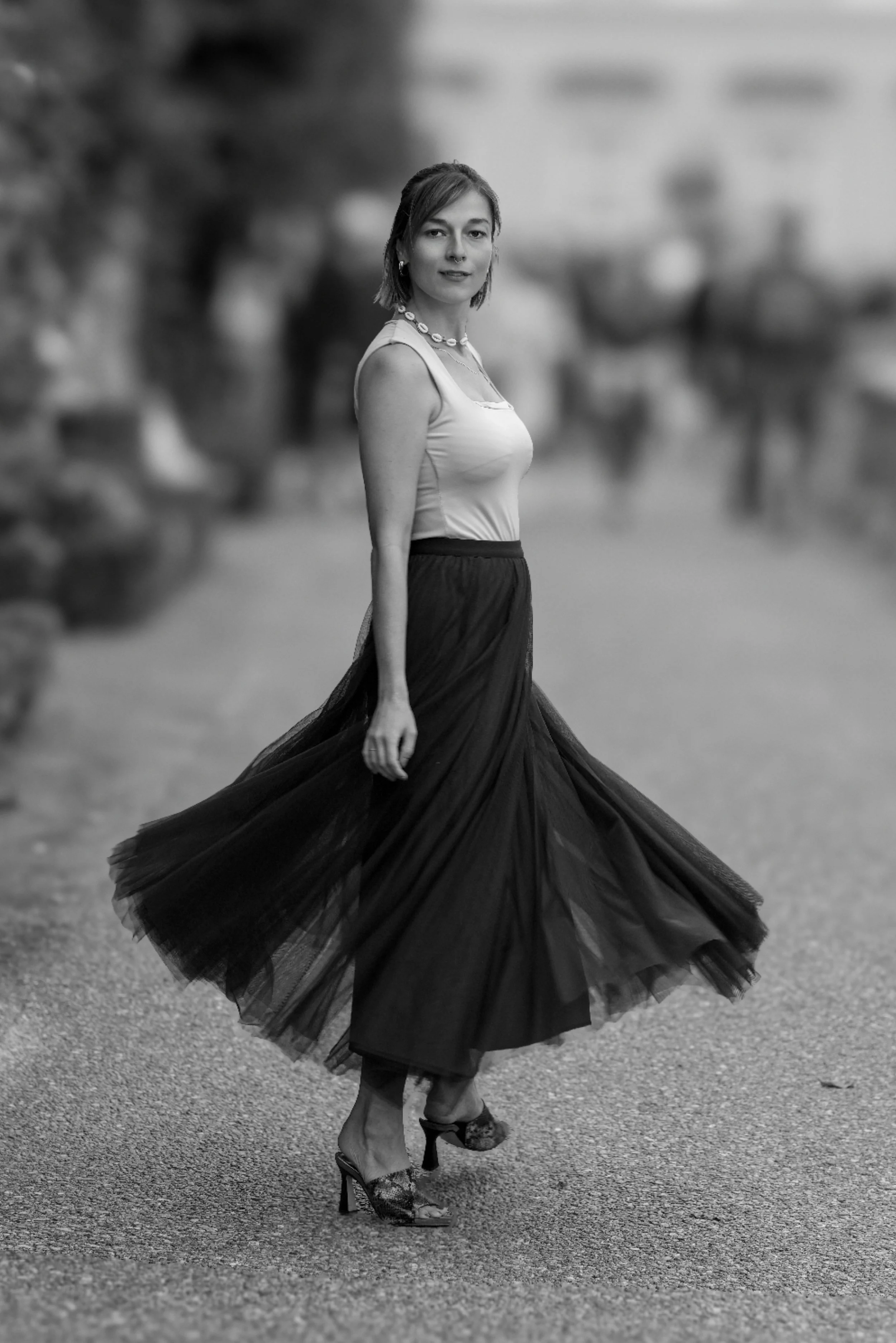 Portrait of Sophie in motion during a photography session in Salzburg, with her flowing skirt adding elegance and movement.