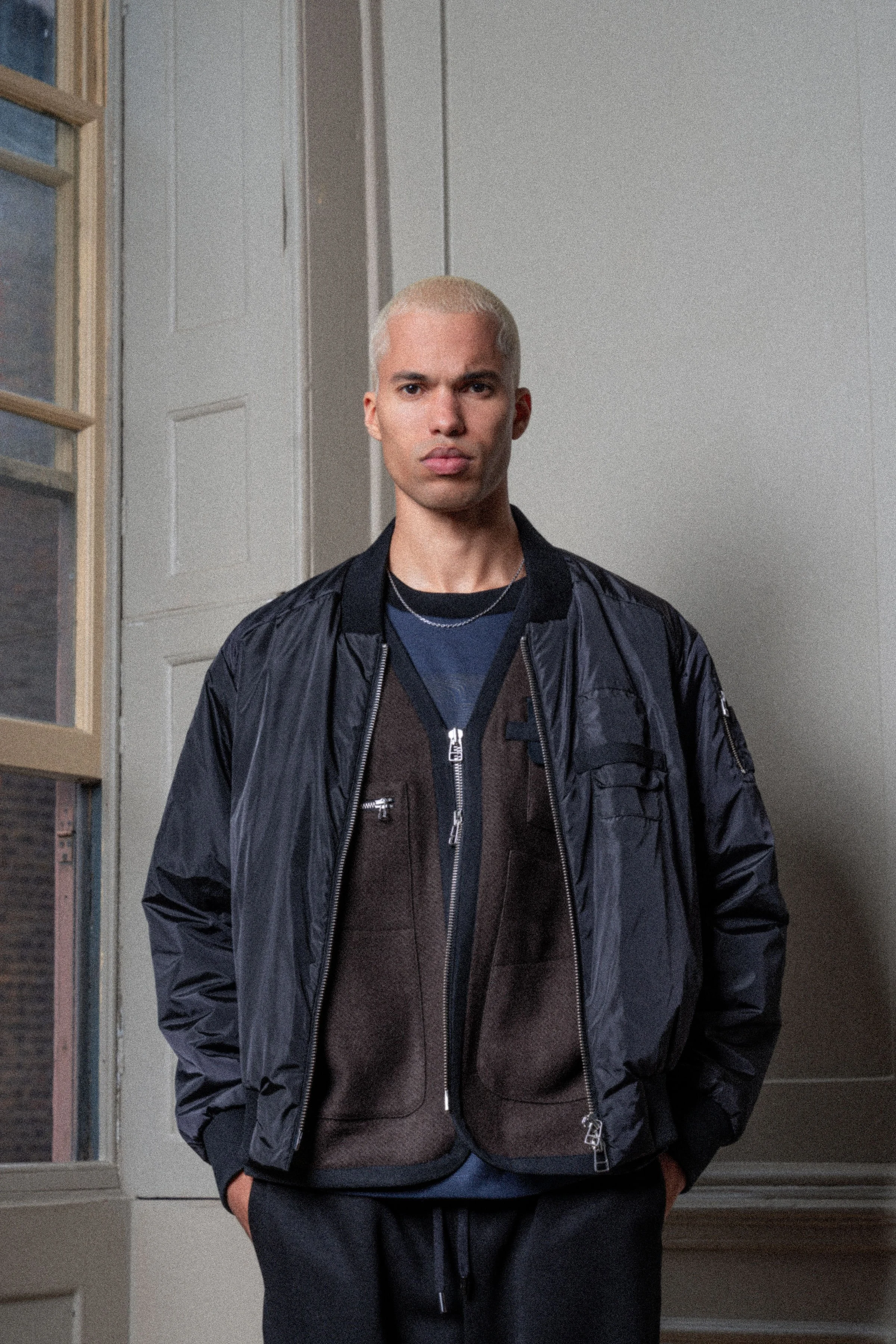 neata fashion brand full service. menswear navy blue bomber jacket with brown wool gilet with black trim designed and developed by James Hillman Fashion Consultancy