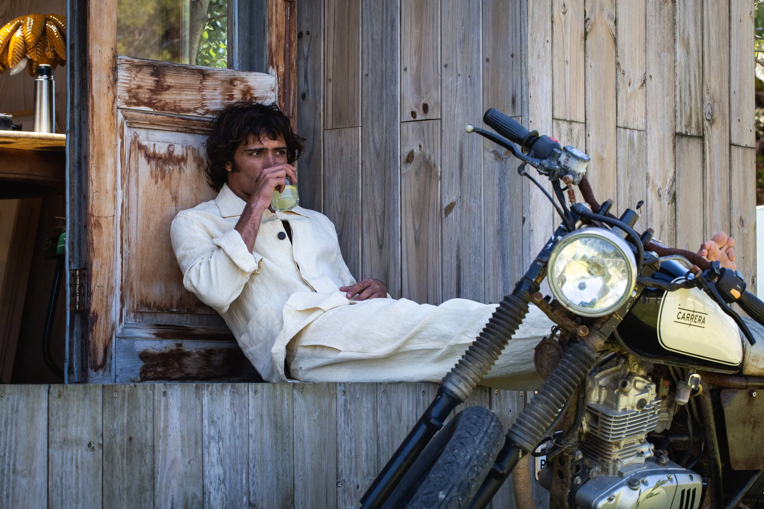 Casa Marane SS26 menswear cream linen by motorbike — relaxed resort wear by James Hillman