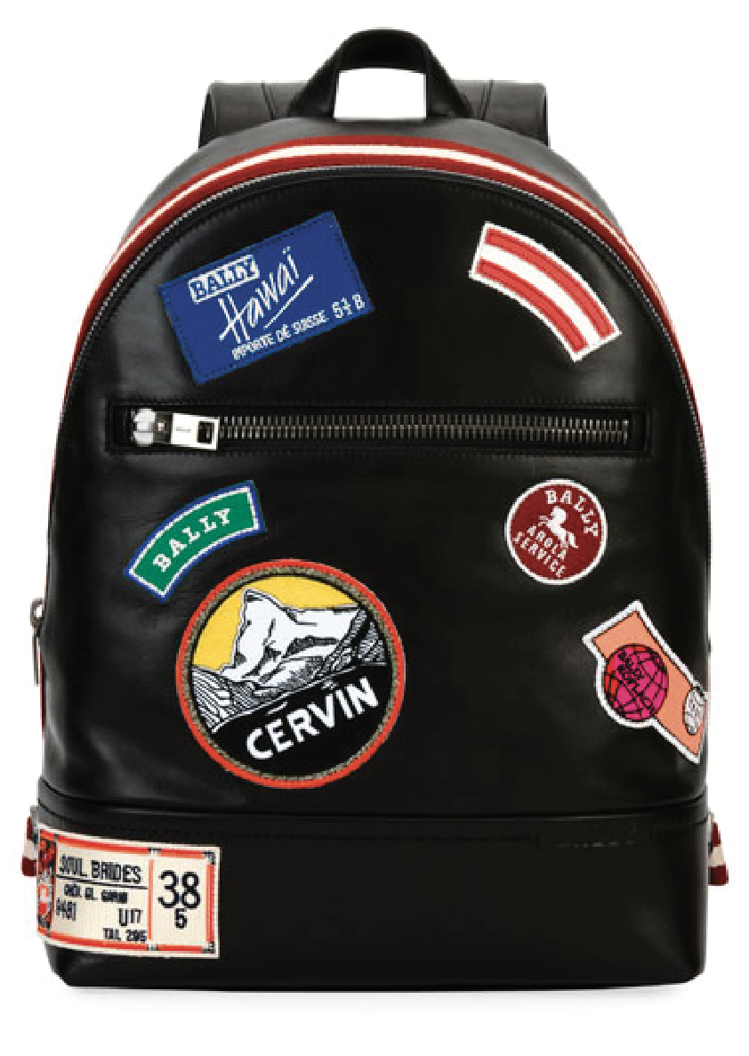 Black leather backpack covered with embroidered heritage badges and patches