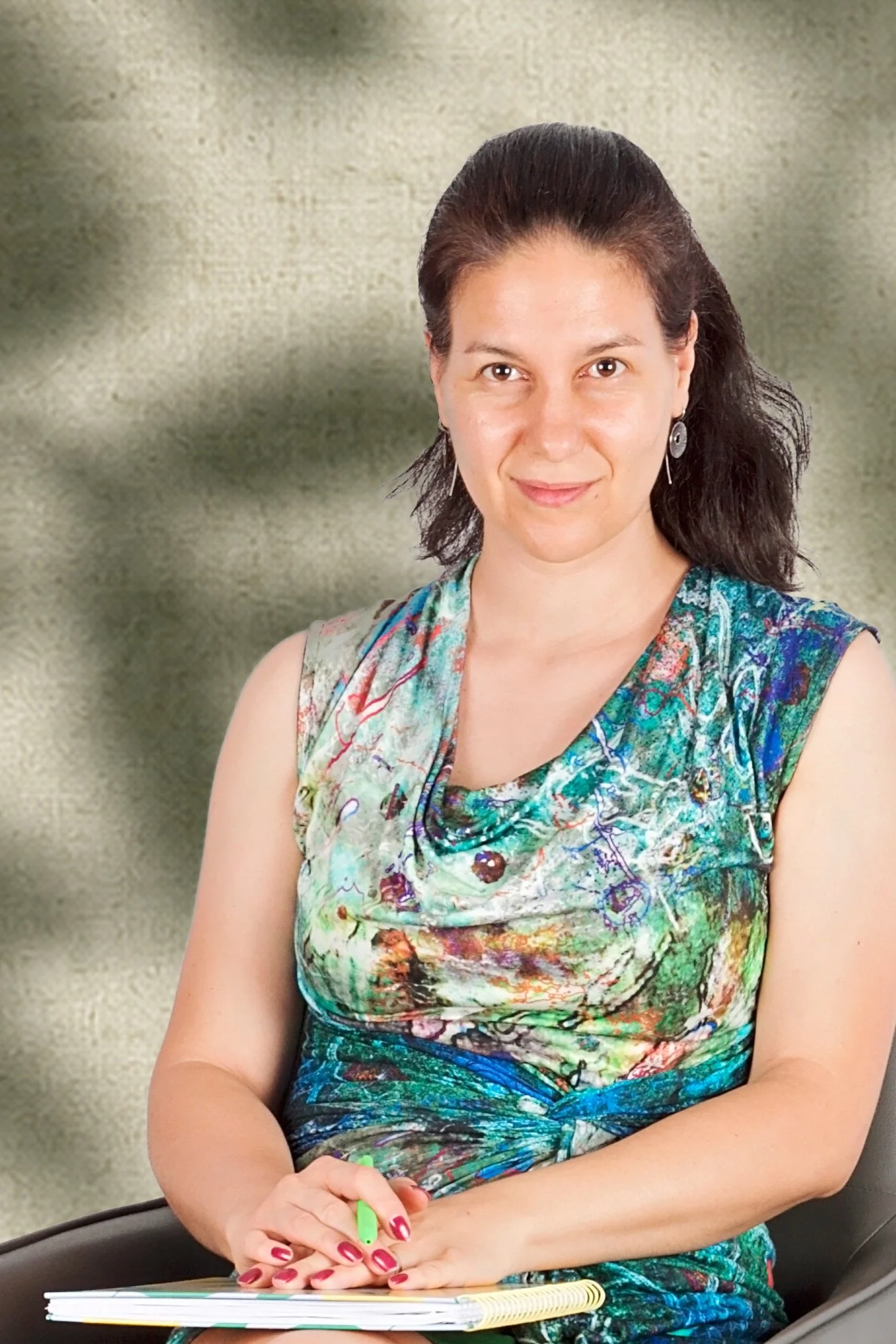a professional headshot of a friendly counsellor smiling warmly
