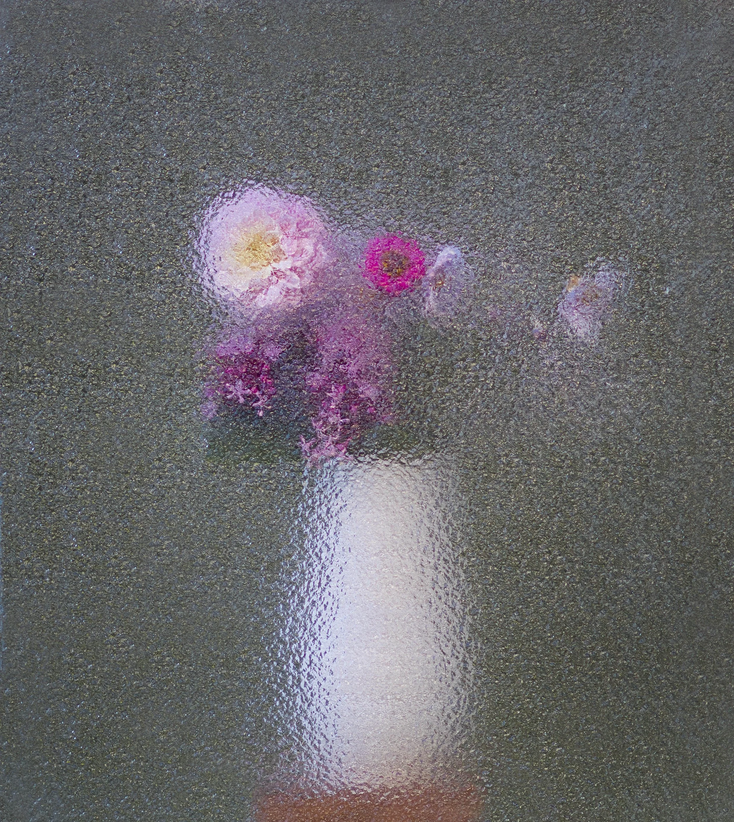 Colorful light reflections on a wet pavement surface, creating a vibrant, abstract pattern.