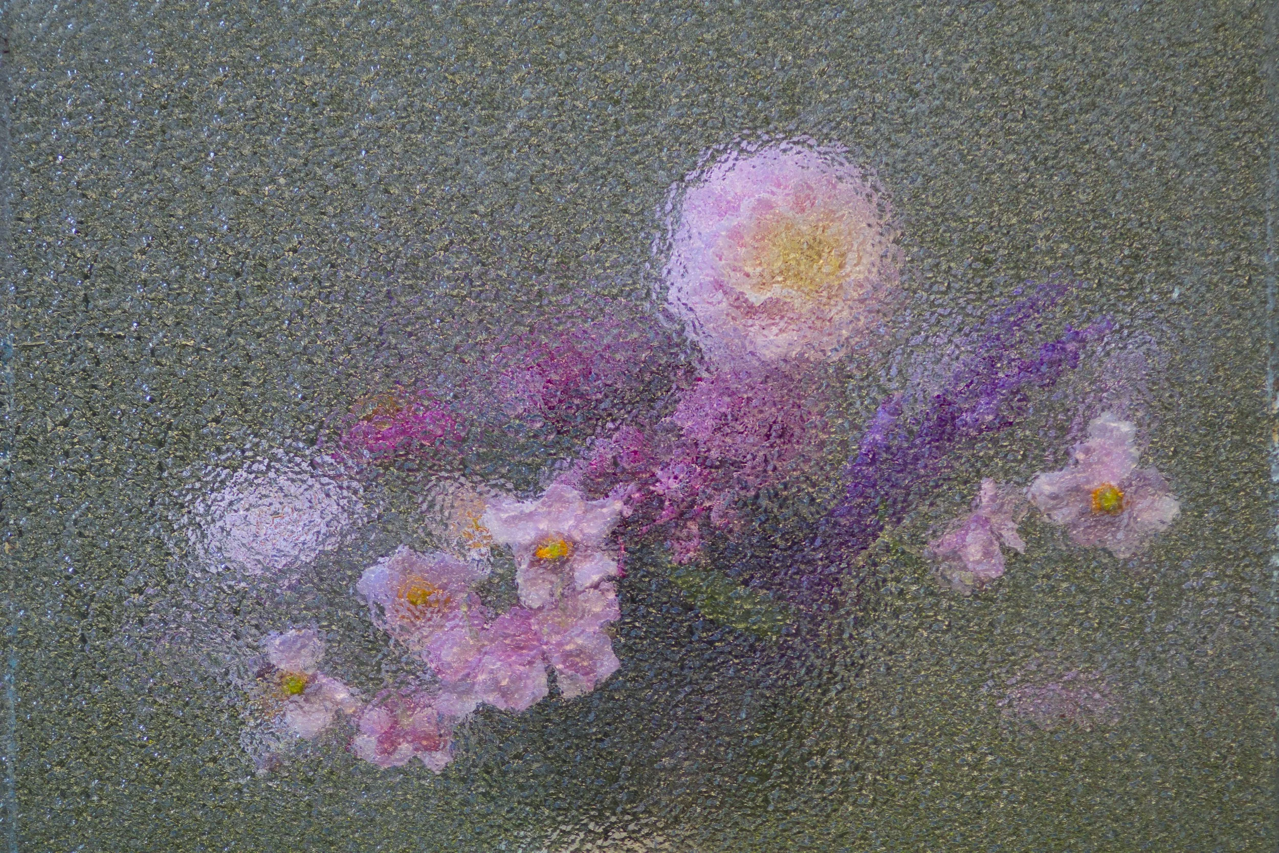 Pink and white cherry blossoms on a dark, textured background.