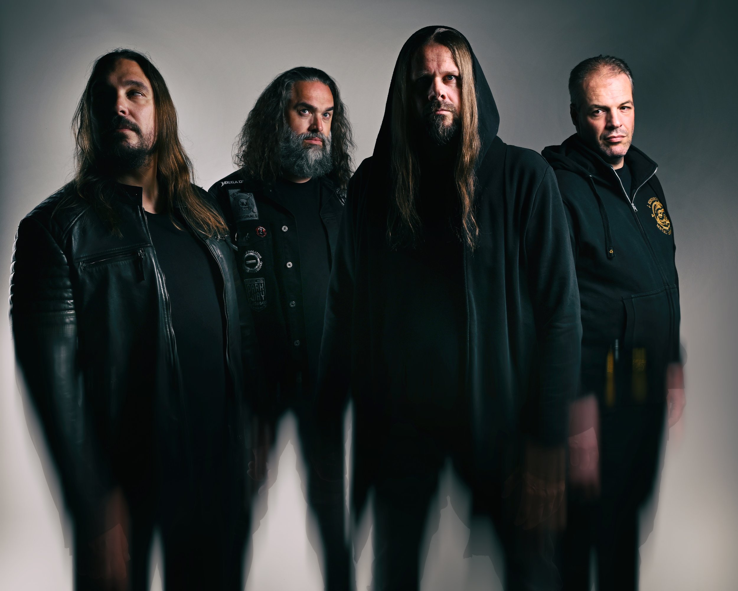 Dutch melodic death metal band The Heritance, featuring four members dressed in black against a studio backdrop.