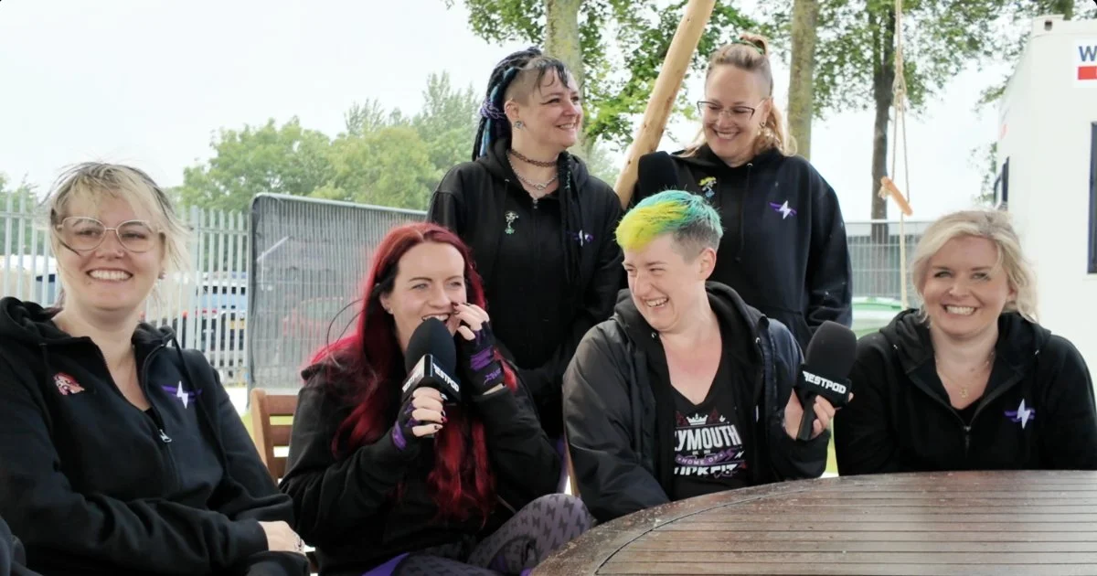 Six members of the RockFit team laughing during an interview with Festpod at Download Festival 2026.