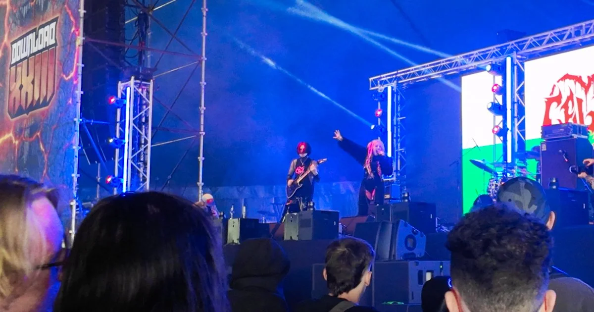 CELAVI performing on the Takeover stage at Download Festival 2026, with the Welsh flag displayed on the stage screen.