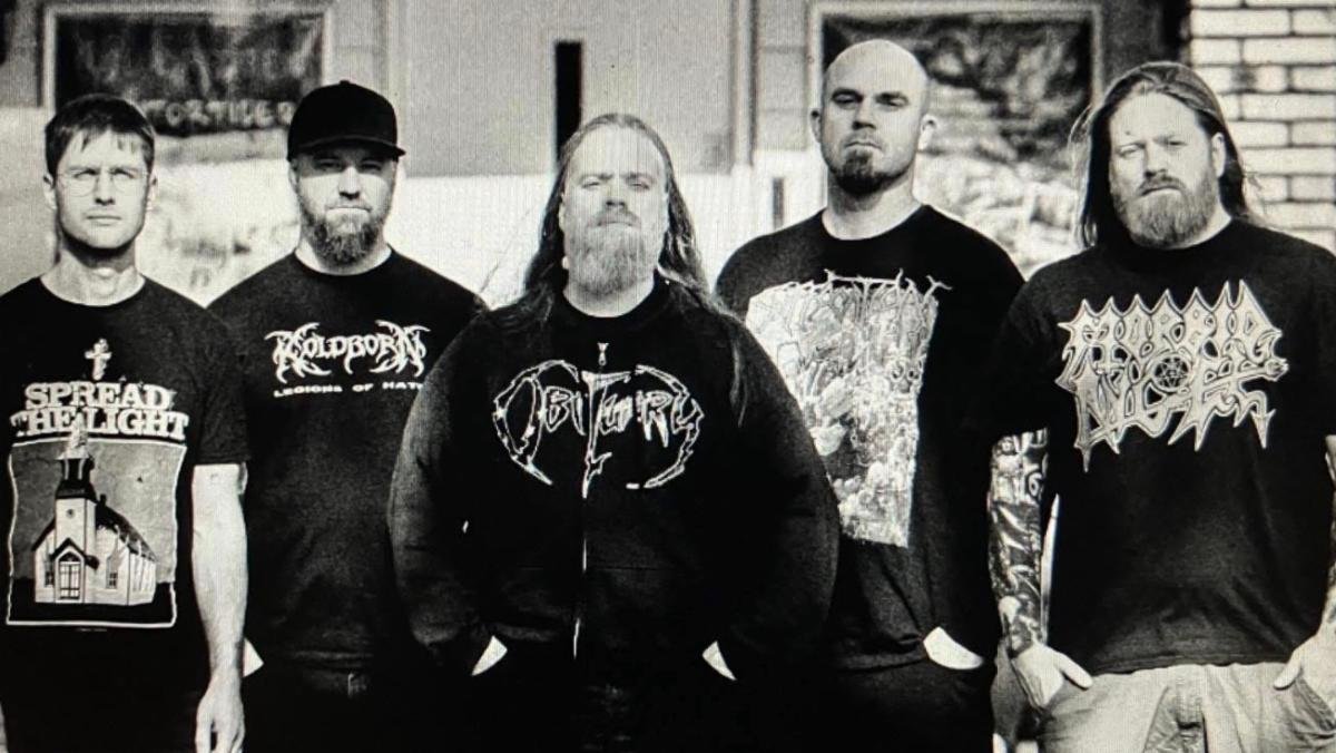 The five members of Danish death metal band Dawn Of Demise in a black-and-white promotional photograph.