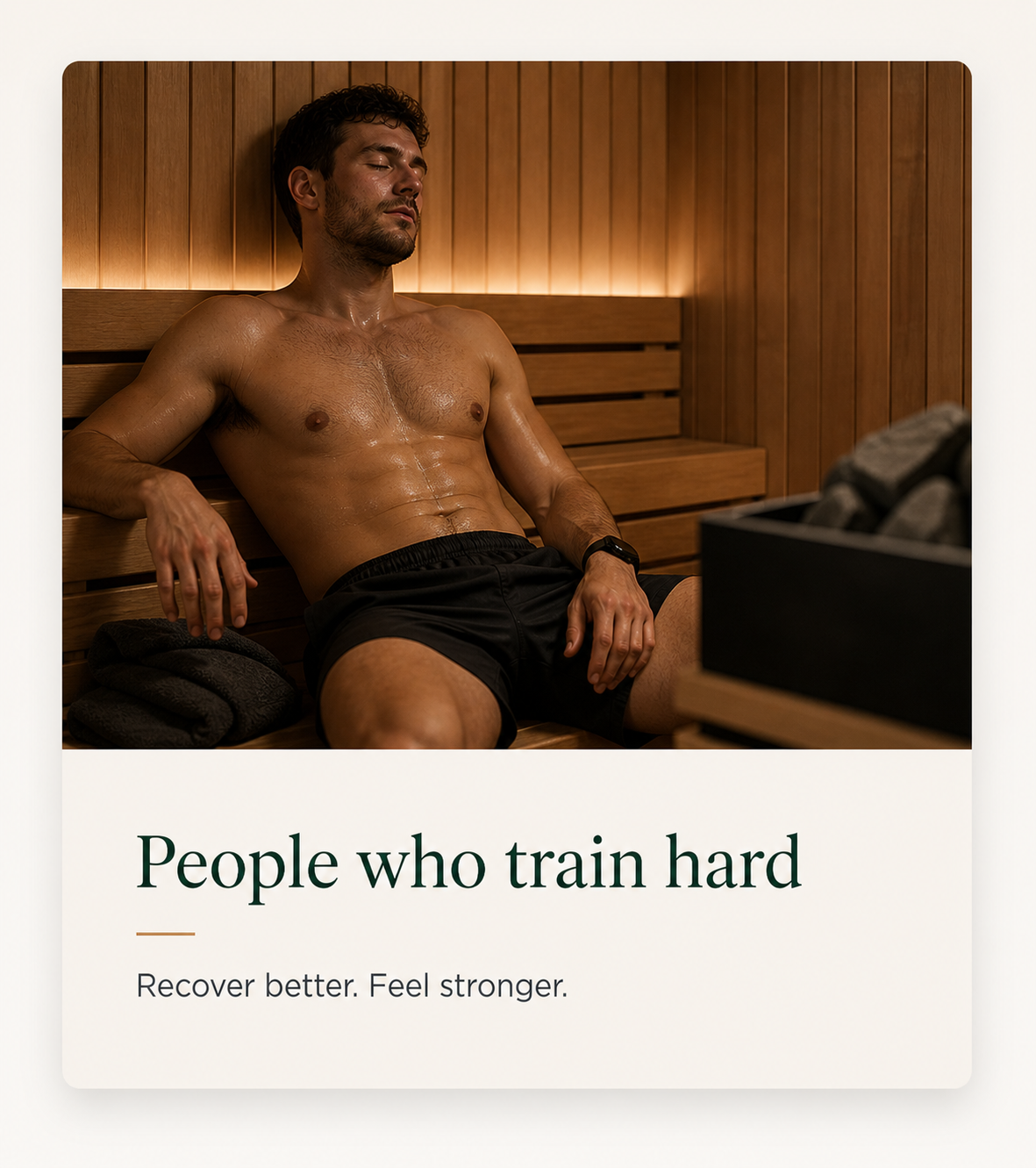 A shirtless man resting in a sauna with wooden walls, wearing black shorts and a watch, appearing relaxed and sweaty.