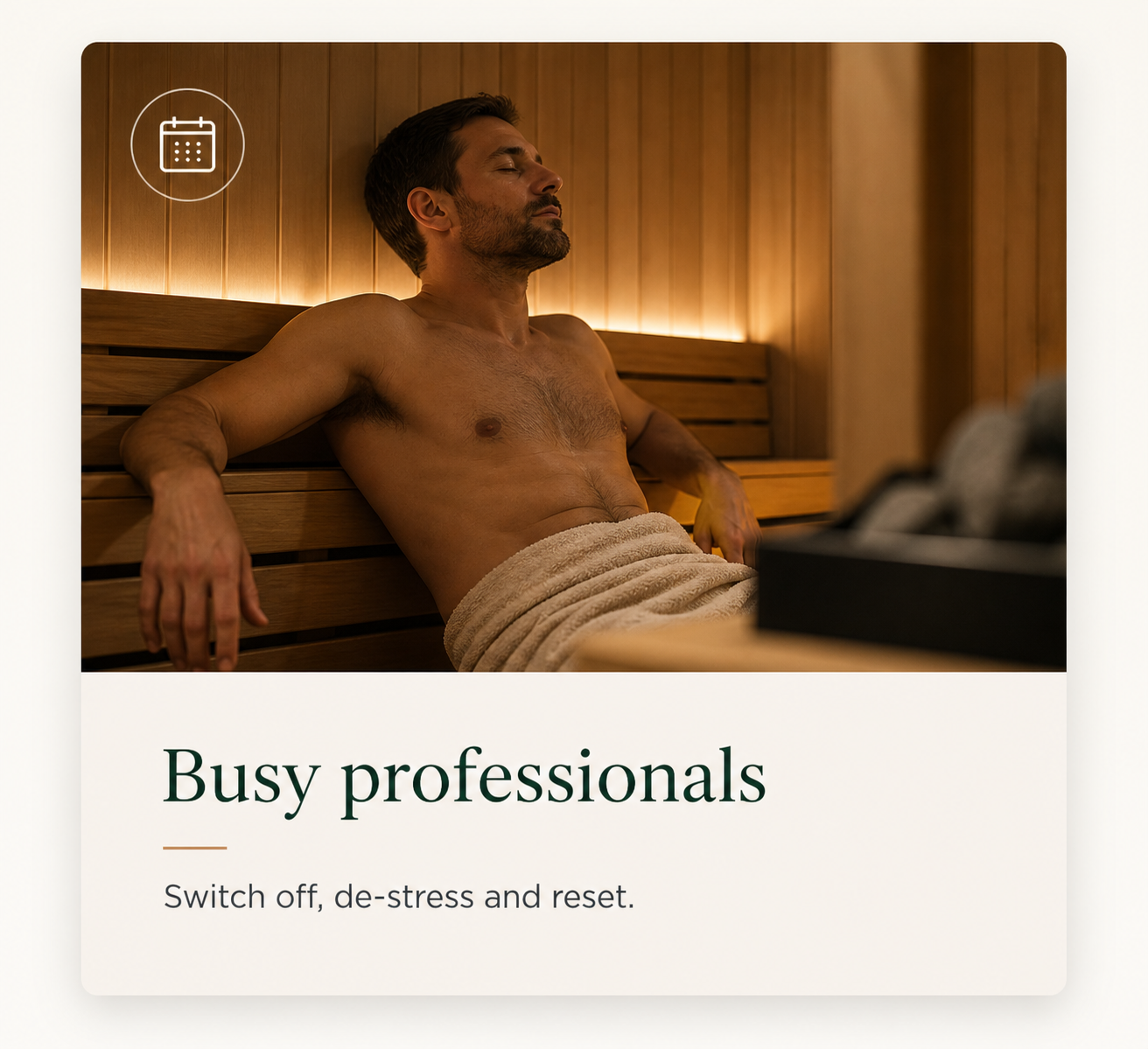 A man relaxing in a sauna, covered with a towel, with closed eyes and a peaceful expression.