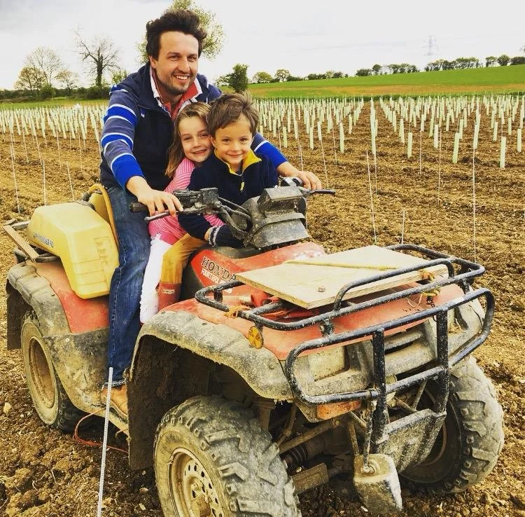 Sam Pimblett on a quad bike at the House of Henham vineyard in Essex.