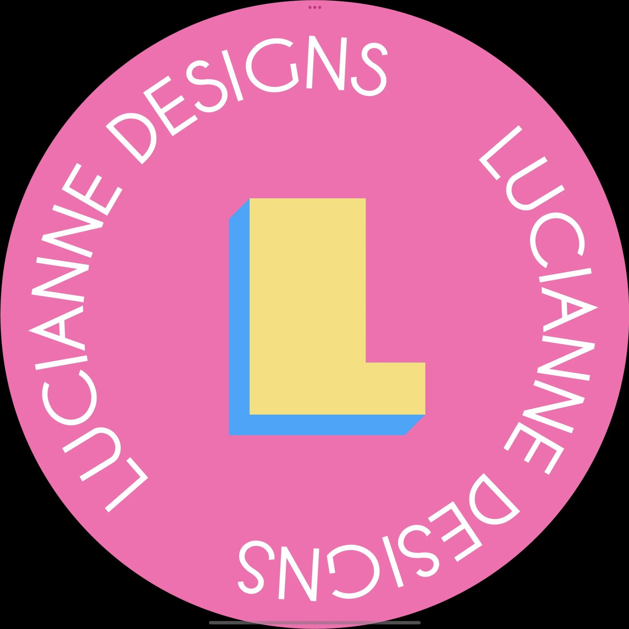 Close-up of a circular pink badge with white text saying "WOMENS DESIGNS LIKE US" around the edge, and a yellow and blue square in the center.