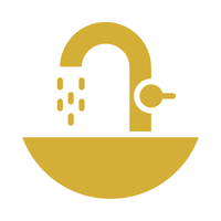 Gold-colored sink with a faucet and water dripping from it