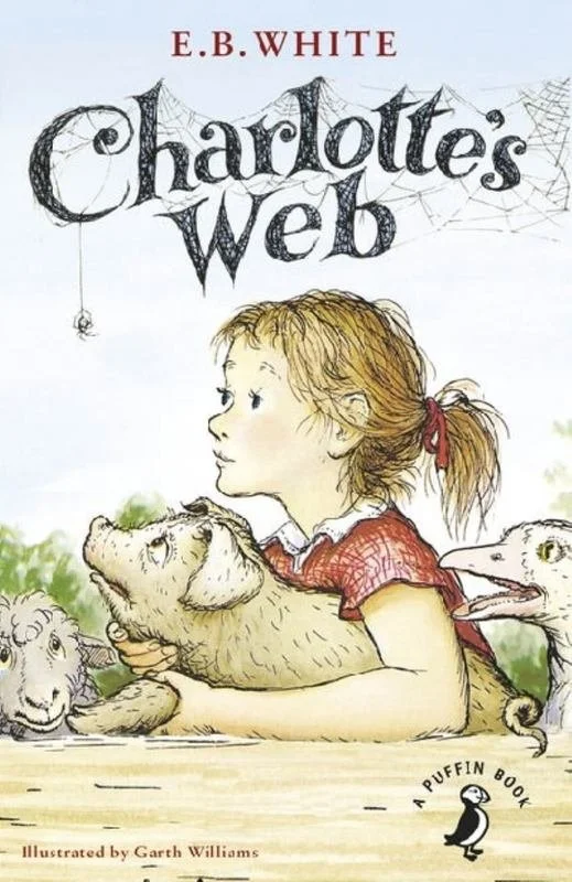 Cover of Charlotte's Web by E.B. White, illustrated by Garth Williams, featuring a girl with red hair and animals including a pig, sheep, and a goose, with spider webs in the background.