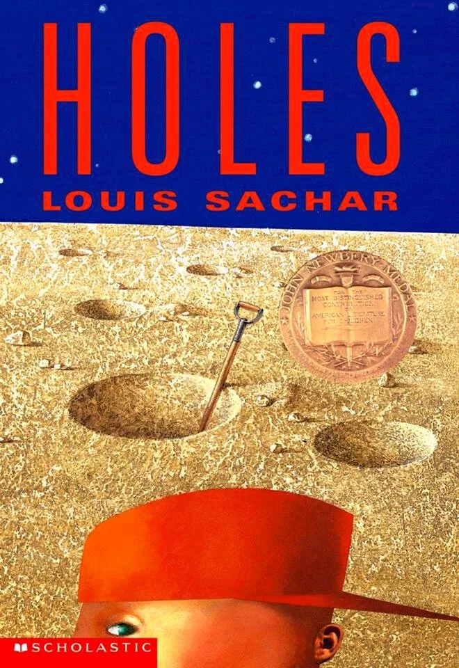 Book cover titled "Holes" by Louis Sachar, featuring a desert landscape with a large hole and a shovel, and part of a child's face at the bottom.