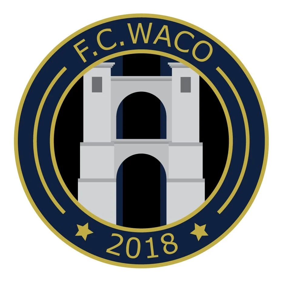 A circular emblem with a gold border and blue background. The emblem features a depiction of the Tower Bridge. Text reads "F.C. WACO" at the top and "2018" at the bottom, with two gold stars on either side of the year.