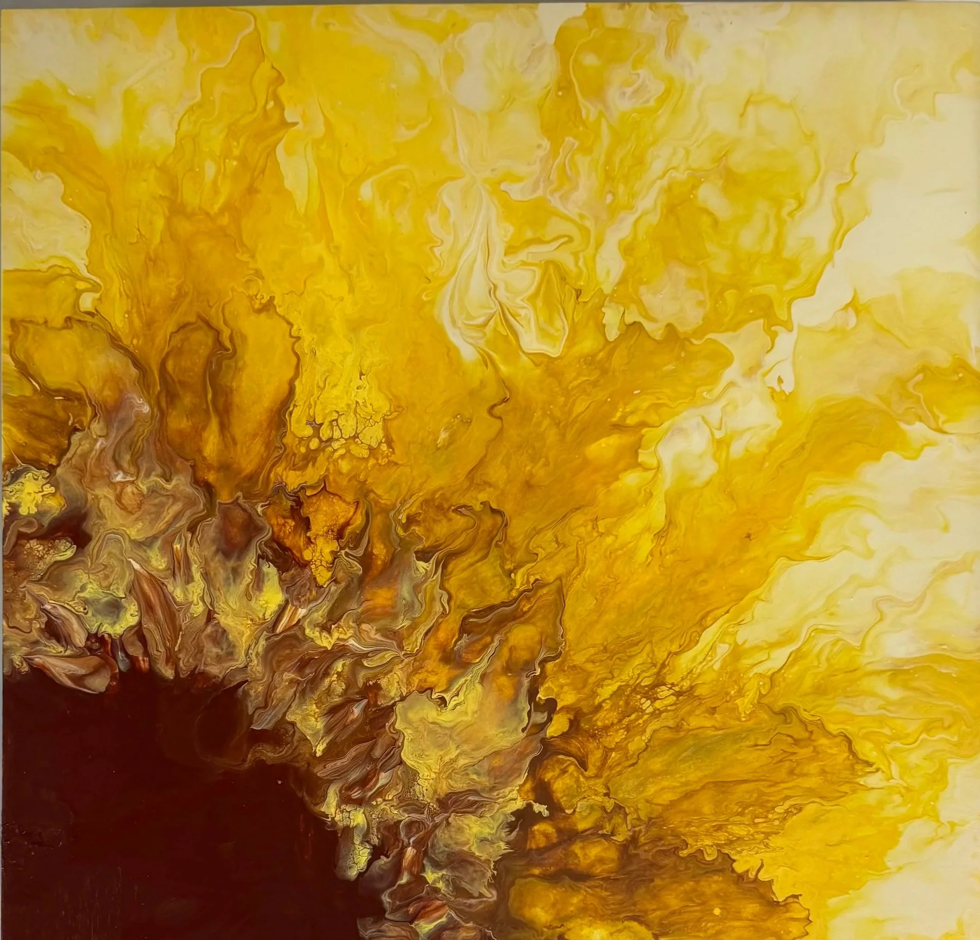 Abstract painting with yellow, brown, and white swirling colors.