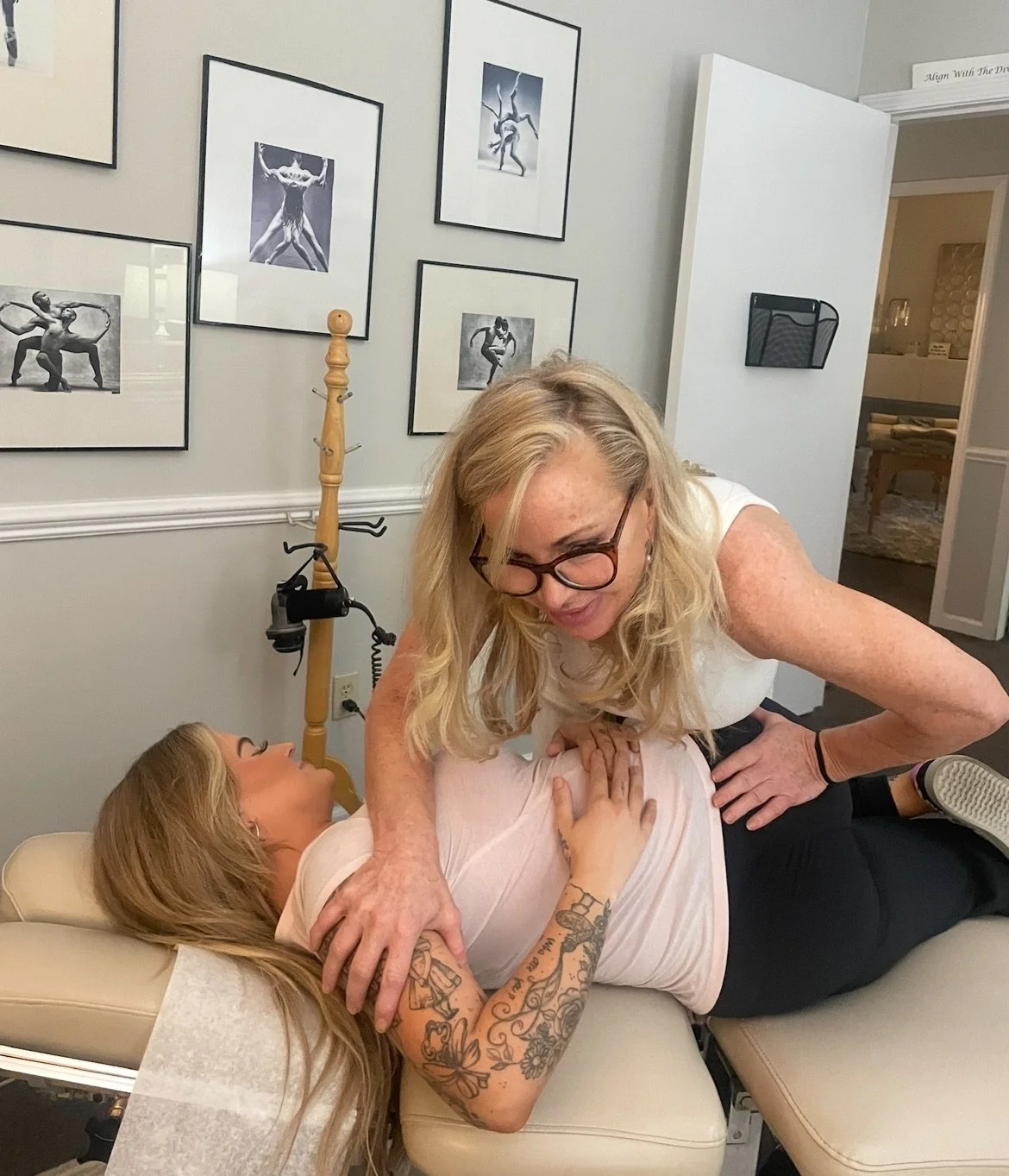 chiropractor adjusting female patient