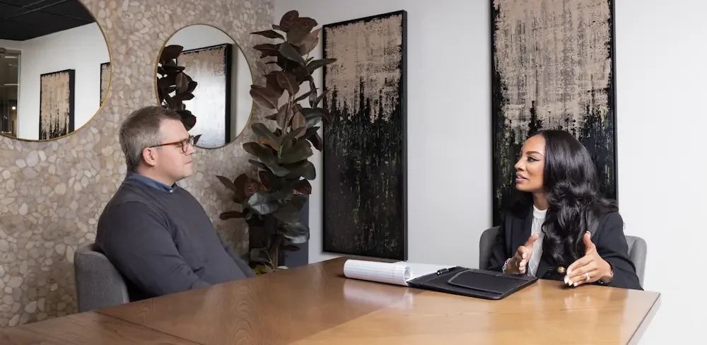 Employment attorney Ashley Futrell Hinkson consulting with a corporate client in Atlanta.