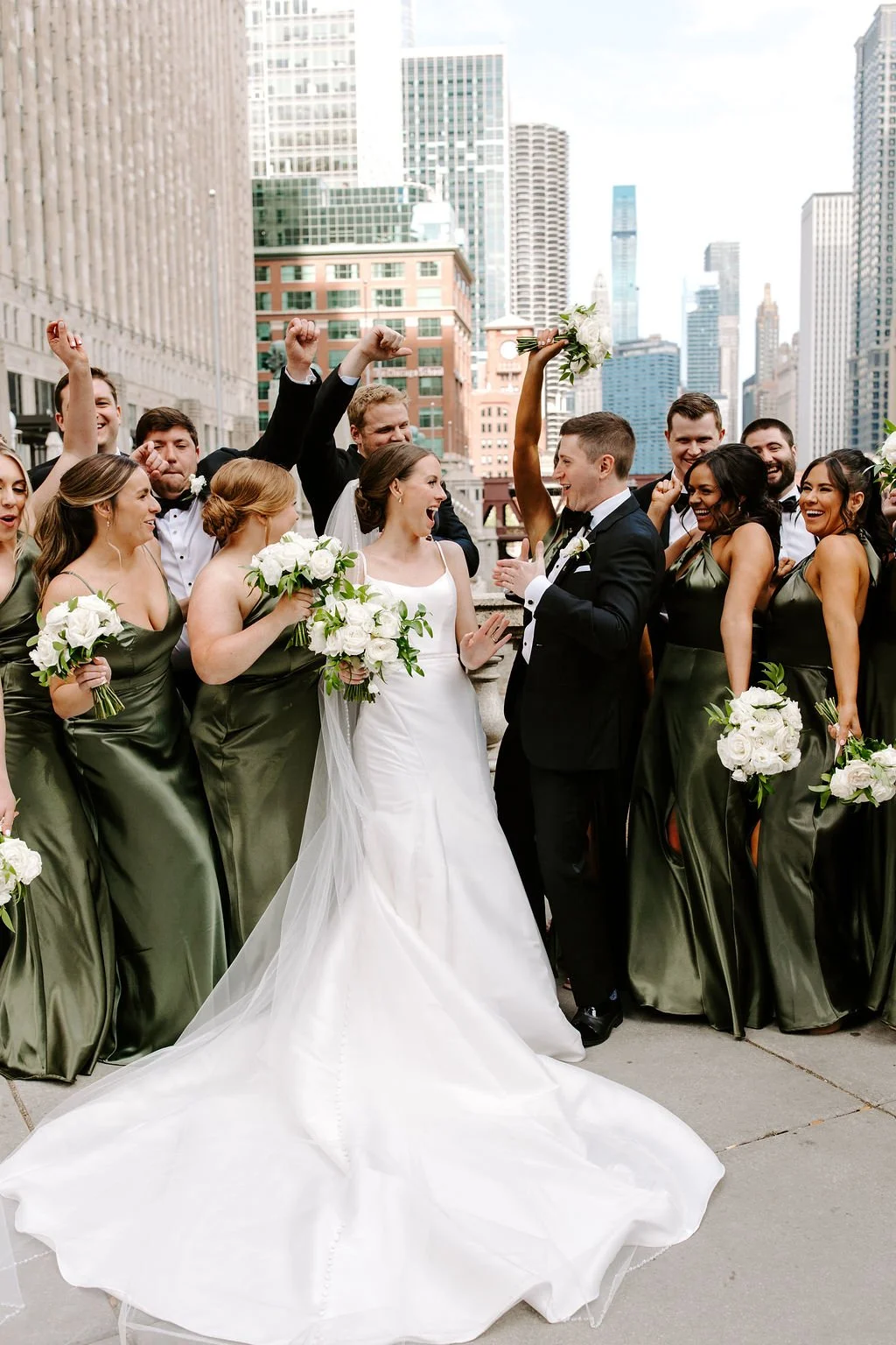 Group of wedding celebration with bride and groom in city