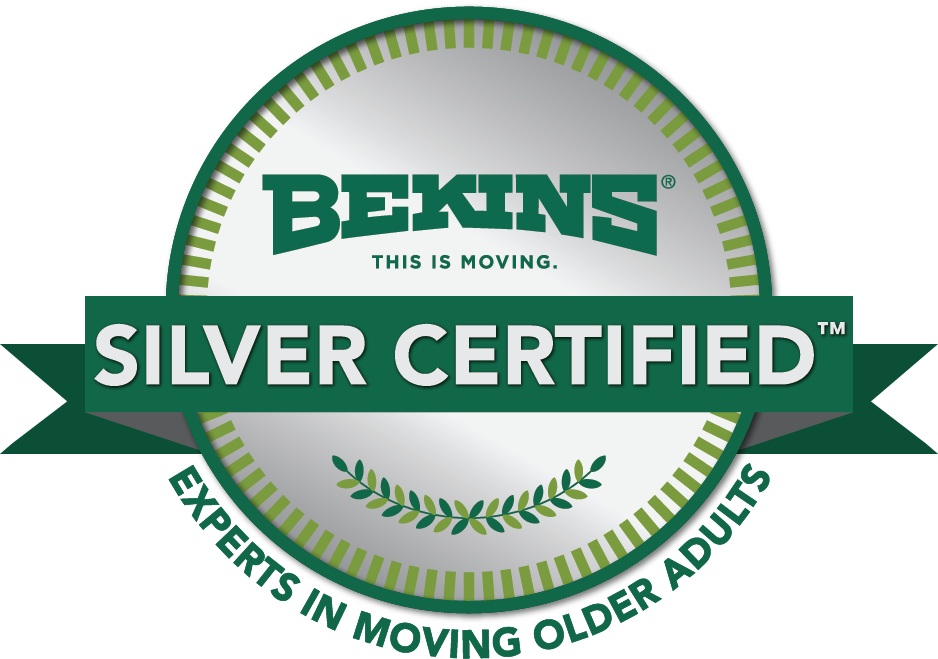 Silver Certified badge for Bekins moving company with green and white colors, featuring the Bekins logo, a laurel branch, and the text 'This is Moving'.